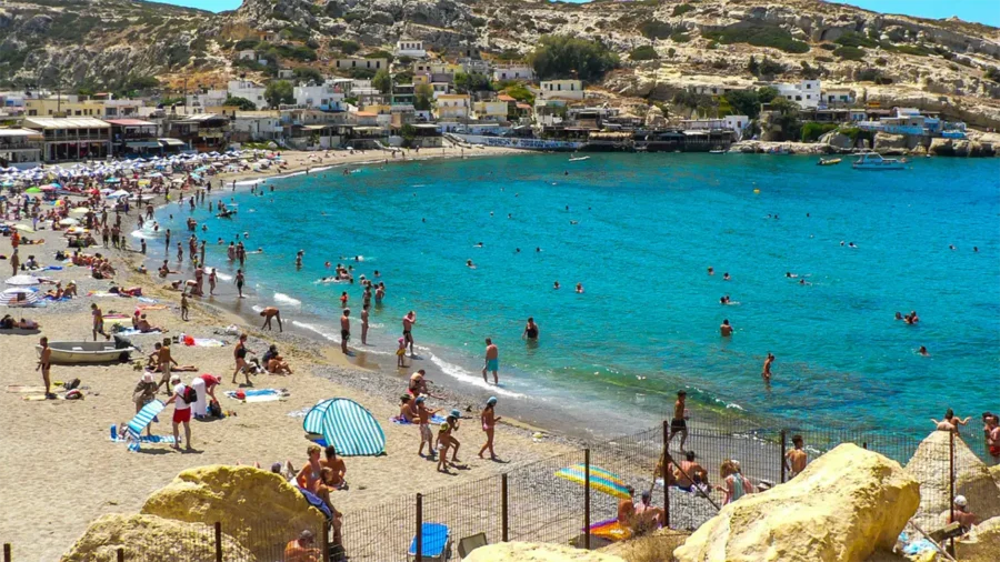 Matala Beach people South Crete tour Gortys Matala